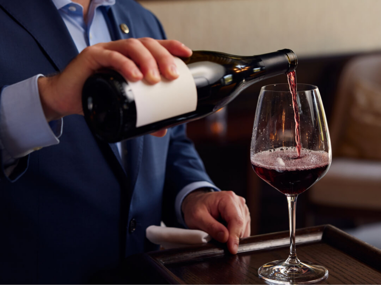 Red wine pouring into a wine glass
